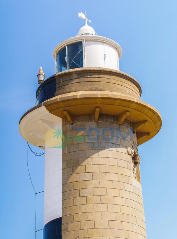 Historic lighthouse tower at Colombo Port with stone base