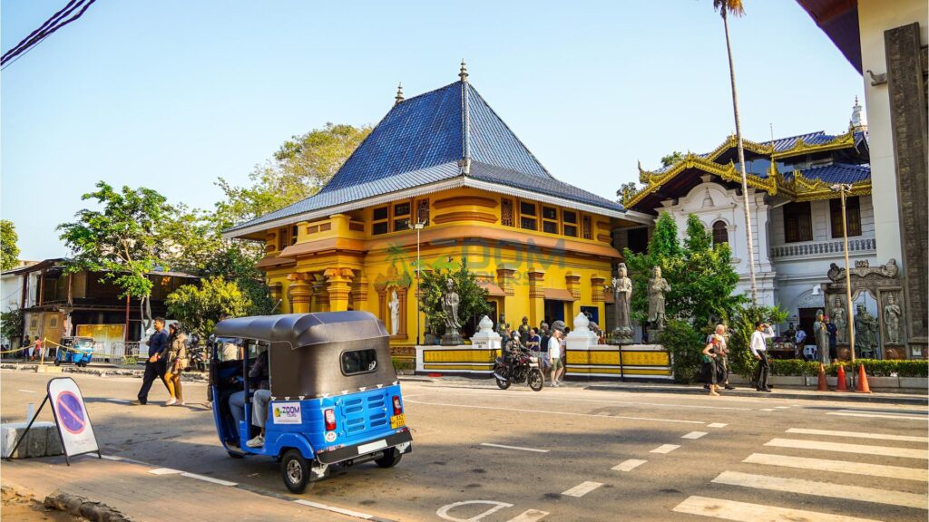 A tuk tuk parked near Colombo’s Gangaramaya Temple