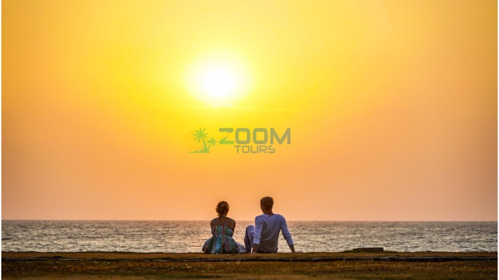 Couple at Galle Face Green enjoying the sunset during Colombo City Romantic Tour.