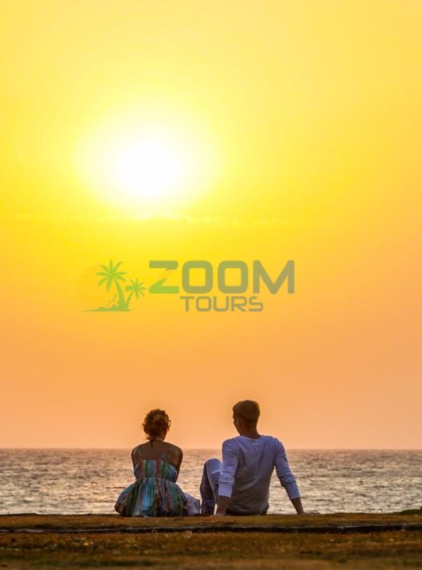 Couple at Galle Face Green enjoying the sunset during Colombo City Romantic Tour.